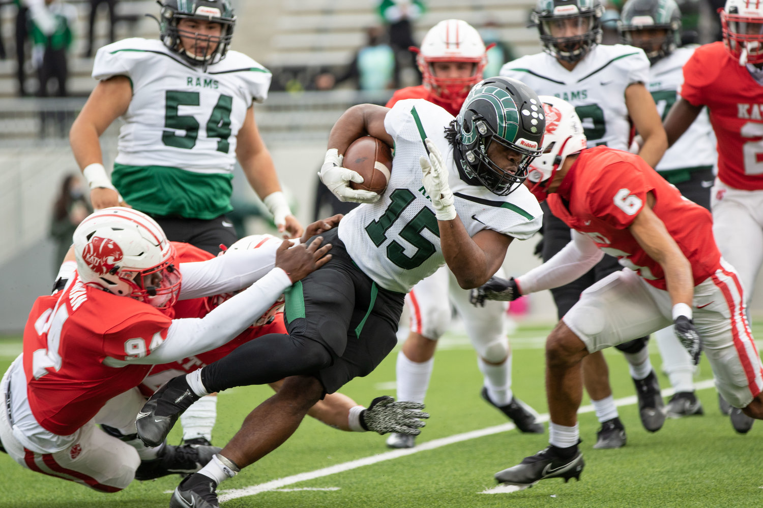 Mayde Creek senior running back Julius Loughridge (15) powers through defenders during a game against Katy earlier this season at Legacy Stadium. Loughridge was named District 19-6A’s Offensive Player of the Year.